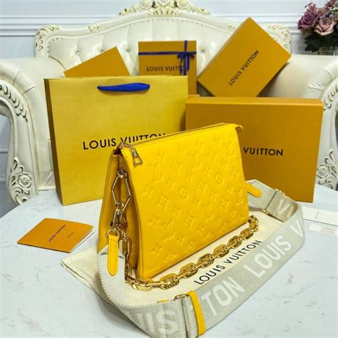 grey louis vuitton clutch yellow lettering|Louis Vuitton coussin bag.